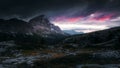 Red clouds of the sunrise with dramatic mountain landscape in th