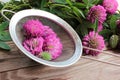 Red clover flowers in a strainer prepared for herbal tea or infusion. Natural wooden background Royalty Free Stock Photo