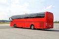Red Coach Bus Departs for Journey Royalty Free Stock Photo