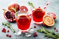 Red cocktail with blood orange and pomegranate. Refreshing summer drink. Holiday aperitif for Christmas party. Royalty Free Stock Photo