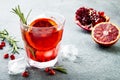 Red cocktail with blood orange and pomegranate. Refreshing summer drink. Holiday aperitif for Christmas party. Royalty Free Stock Photo