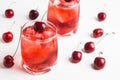 Red cocktail with cherry
