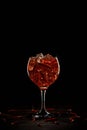 Red cocktail in a glass with ice and chili peppers. Valentine's Day Concept Royalty Free Stock Photo