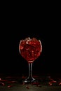 Red cocktail in a glass with ice and chili peppers. Valentine's Day Concept Royalty Free Stock Photo