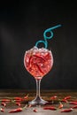 Red cocktail in a glass with ice and chili peppers. Valentine's Day Concept Royalty Free Stock Photo