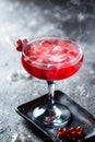 Red cocktail with ice vapor. Cocktail with smoke. Alcohol drink, vodka, ice, party, dry ice.