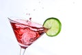 Red cocktail with lime on white Royalty Free Stock Photo