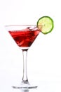 Red cocktail with lime on white Royalty Free Stock Photo