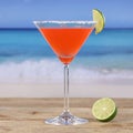 Red cocktail Martini drink on the beach Royalty Free Stock Photo