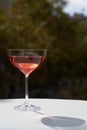 Red cocktail in martini glass with cherry. Exotic alcoholic cocktail Royalty Free Stock Photo