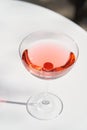 Red cocktail in martini glass with cherry. Exotic cocktail Royalty Free Stock Photo