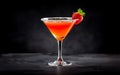 Red cocktail in martini glass with garnish on dark bar background,closeup,copy space,lifestyle Royalty Free Stock Photo