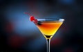 Red cocktail in martini glass with garnish on dark bar background,closeup,copy space,lifestyle Royalty Free Stock Photo