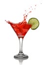 Red cocktail with splash and lime Royalty Free Stock Photo