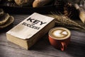 Red coffee cup and concept books for success lay on the wooden f Royalty Free Stock Photo