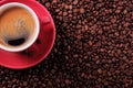 Red coffee cup with espresso and roasted beans top view Royalty Free Stock Photo