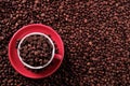 Red coffee cup filled with beans top view copy space Royalty Free Stock Photo