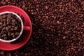 Red coffee cup filled with roasted beans top view copy space Royalty Free Stock Photo