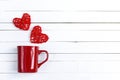Red coffee mug with hearts coming out of it on white wooden bac Royalty Free Stock Photo