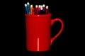 Red coffee mug with mechanical pencils Royalty Free Stock Photo