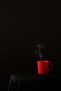 Red Coffee Mug on plain black background