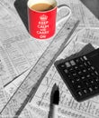 Red Coffee mug on top of papers full of hand written math and calculator Royalty Free Stock Photo