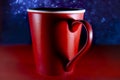 Red coffee or tea cup, heart symbol form in shadow Royalty Free Stock Photo