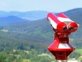 Red coin binoculars for tourists at viewpoint