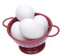 Red Colander with Fresh Eggs Royalty Free Stock Photo