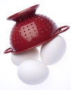 Red Colander with Fresh Eggs Royalty Free Stock Photo
