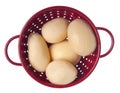 Red Colander Full of Canned New Potatoes Royalty Free Stock Photo