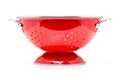 Red colander over white background Royalty Free Stock Photo