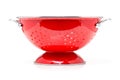Red colander over white background Royalty Free Stock Photo