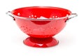 Red colander over white background Royalty Free Stock Photo