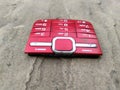 Red color broken mobile keypad put on road Royalty Free Stock Photo