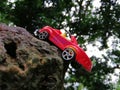 Red color car toy in stone picture