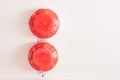 Red color fire detector mounted on the ceiling. Sensor triggered by smoke Royalty Free Stock Photo