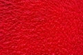 Red color fur background, soft wool material texture Royalty Free Stock Photo