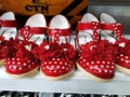 Red Color Girl Baby Shoes in a Shelf for Sale in a Mall. Interior design of a Foot Wear Department in Vishal Mall, Laggere
