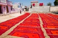 Red color handmade textile dry on sunny place