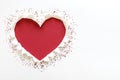 Red color heart love shape with tear white paper.