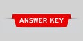 Red inserted label with word answer key on gray background