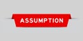 Red inserted label with word assumption on gray background