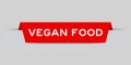 Red inserted label with word vegan food on gray background