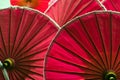 Red color umbrellas close up, traditional craftsmanship in Chiangmai, Thailand