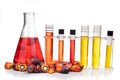 Red color unrefined palm oil and fruits with beaker test tube in laboratory