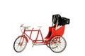 Red color vintage oriental rickshaw cab, miniature