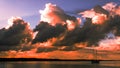 Red colored cumulonimbus cloud, sunset seascape. Royalty Free Stock Photo