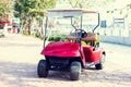 Red colored golf cart