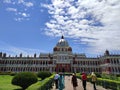 Red colored ROYAL Palace of encient India under the shining Sun with some white clouds in blue sky.